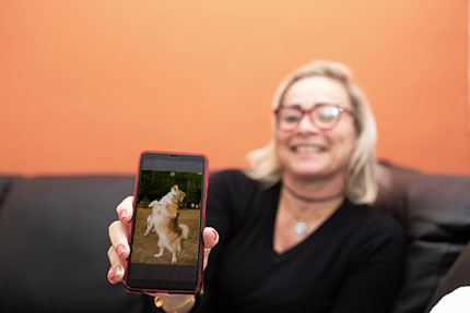 woman showing photo of dog